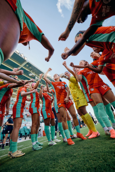 Team Huddle Before The Soccer Match